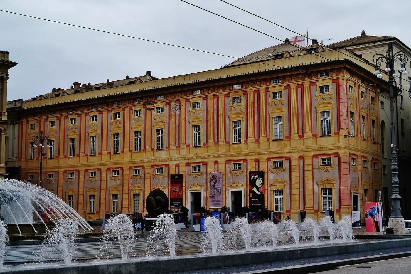 The Palazzo Ducale, palace of the Doges of Genoa, behind the fountain of Piazza De Ferrari