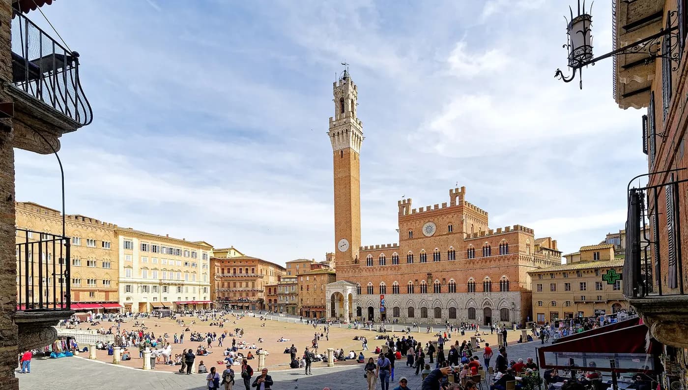 The shell-shaped Piazza del Campo in Siena, facing the Palazzo Pubblico and its tall Torre del Mangia
