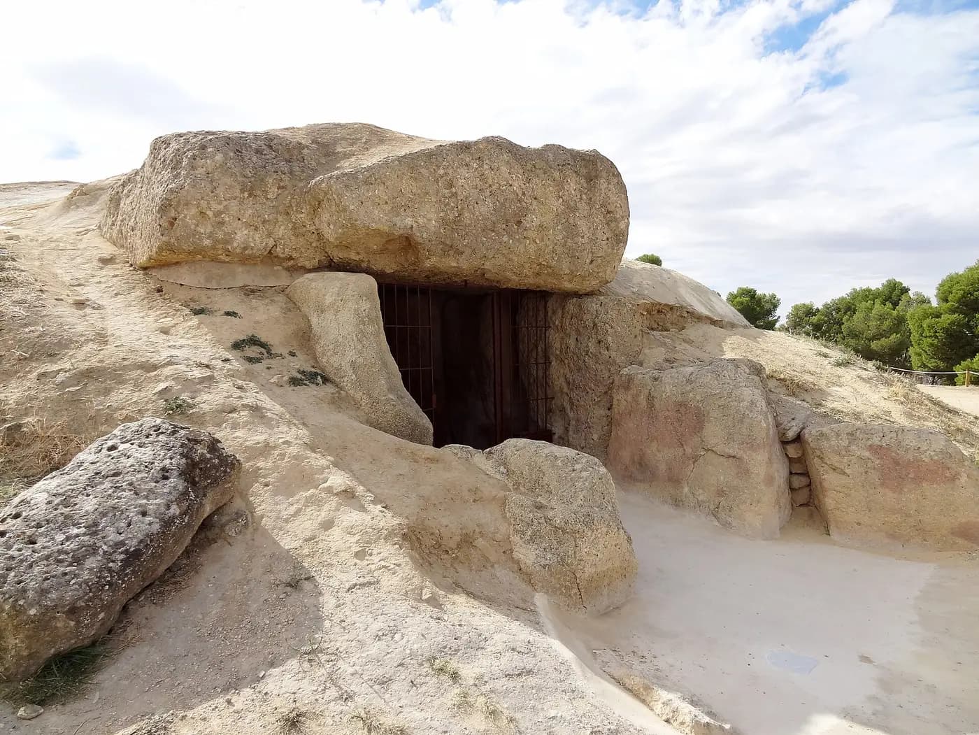 The great capstone and stone-framed entrance of the Dolmen of Menga in Antequera