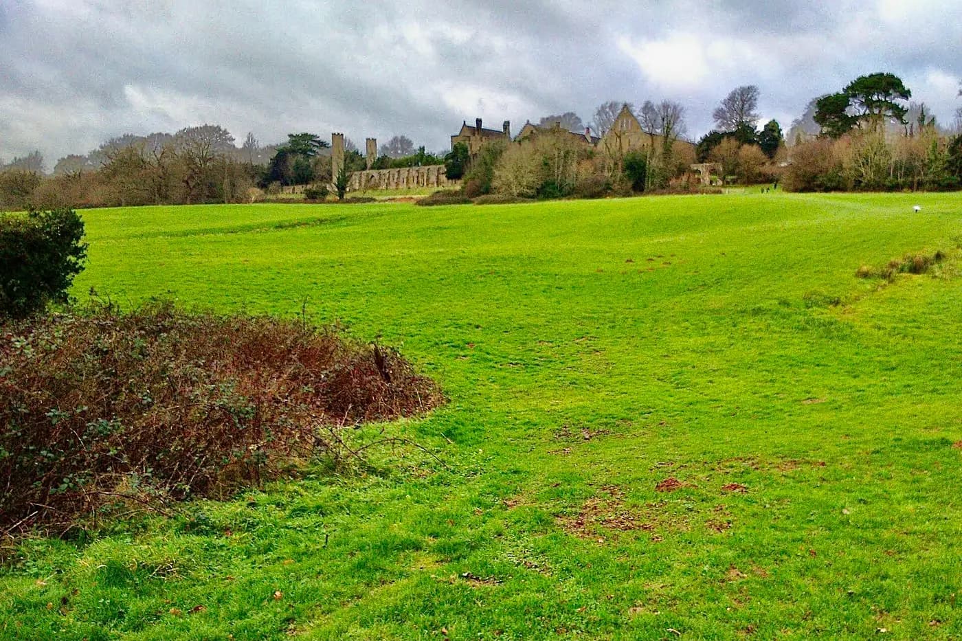 The open grassy slope of the Hastings battlefield below Battle Abbey