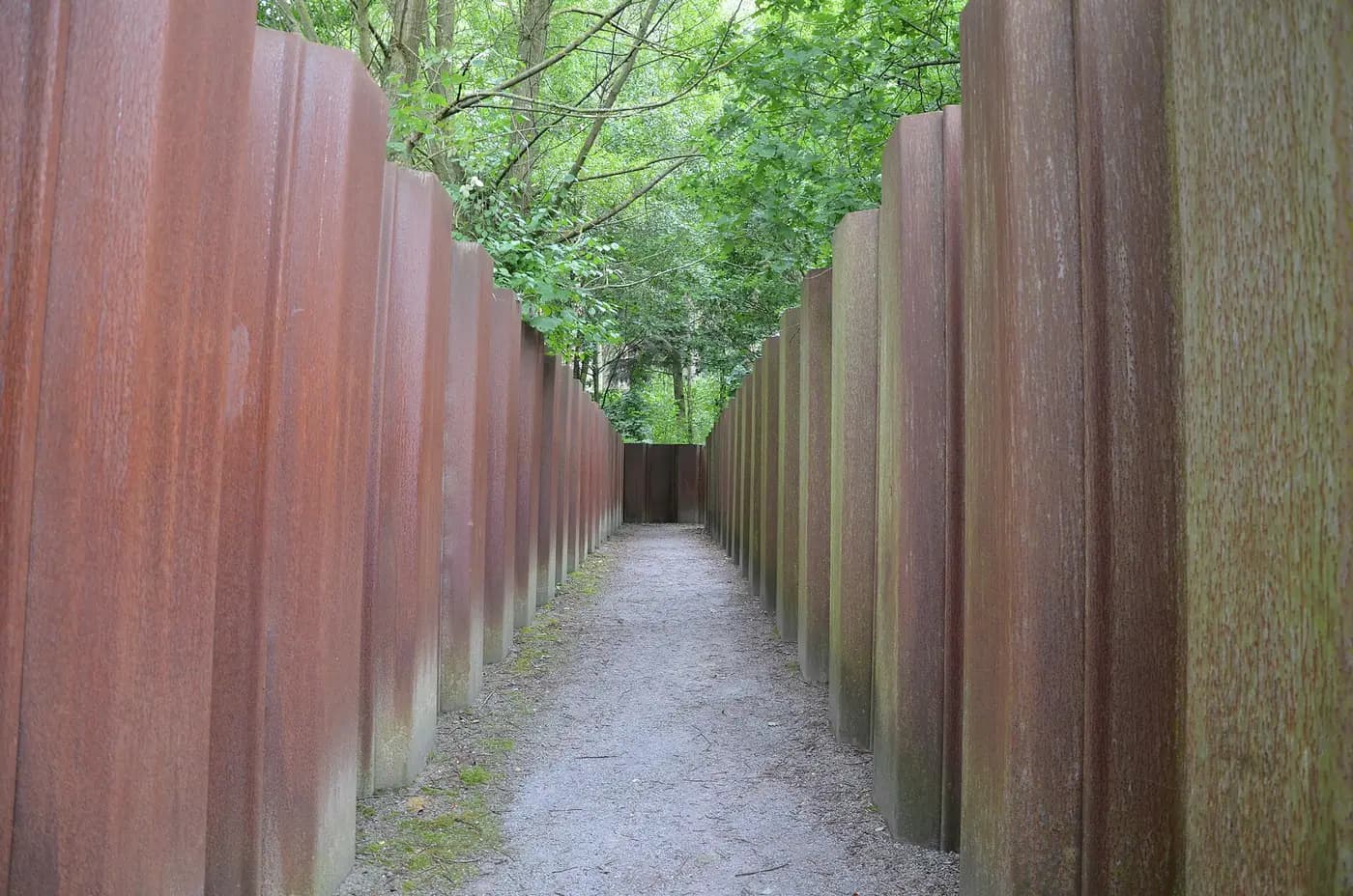 Rusted steel posts in the Kalkriese park trace the rampart line where Varus's legions were ambushed