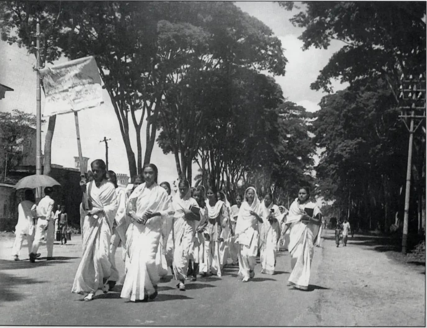 Women students of Dhaka University march with banners in a Language Movement procession, February 1952