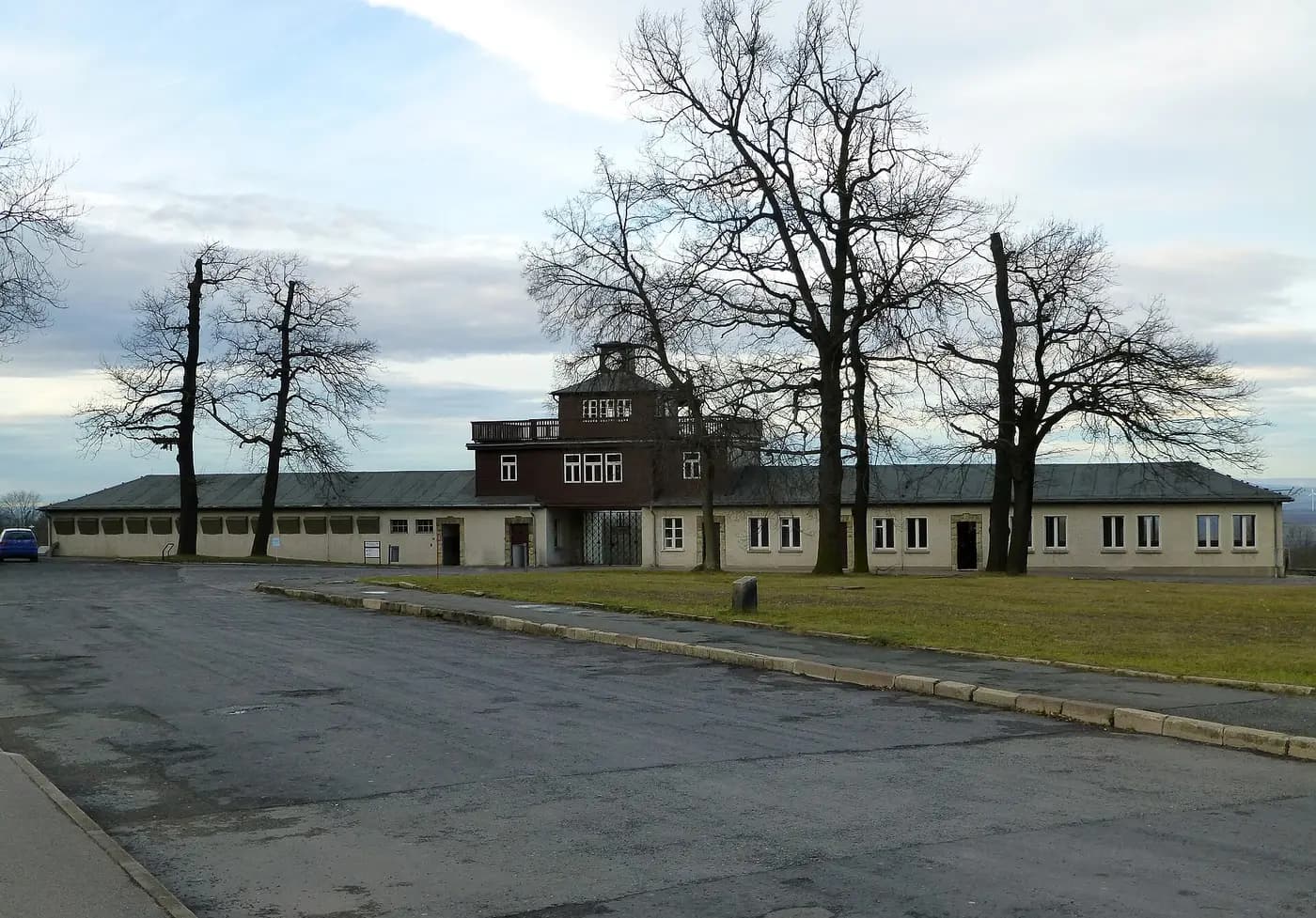 The gatehouse of the former Buchenwald concentration camp on the Ettersberg, framed by bare winter trees