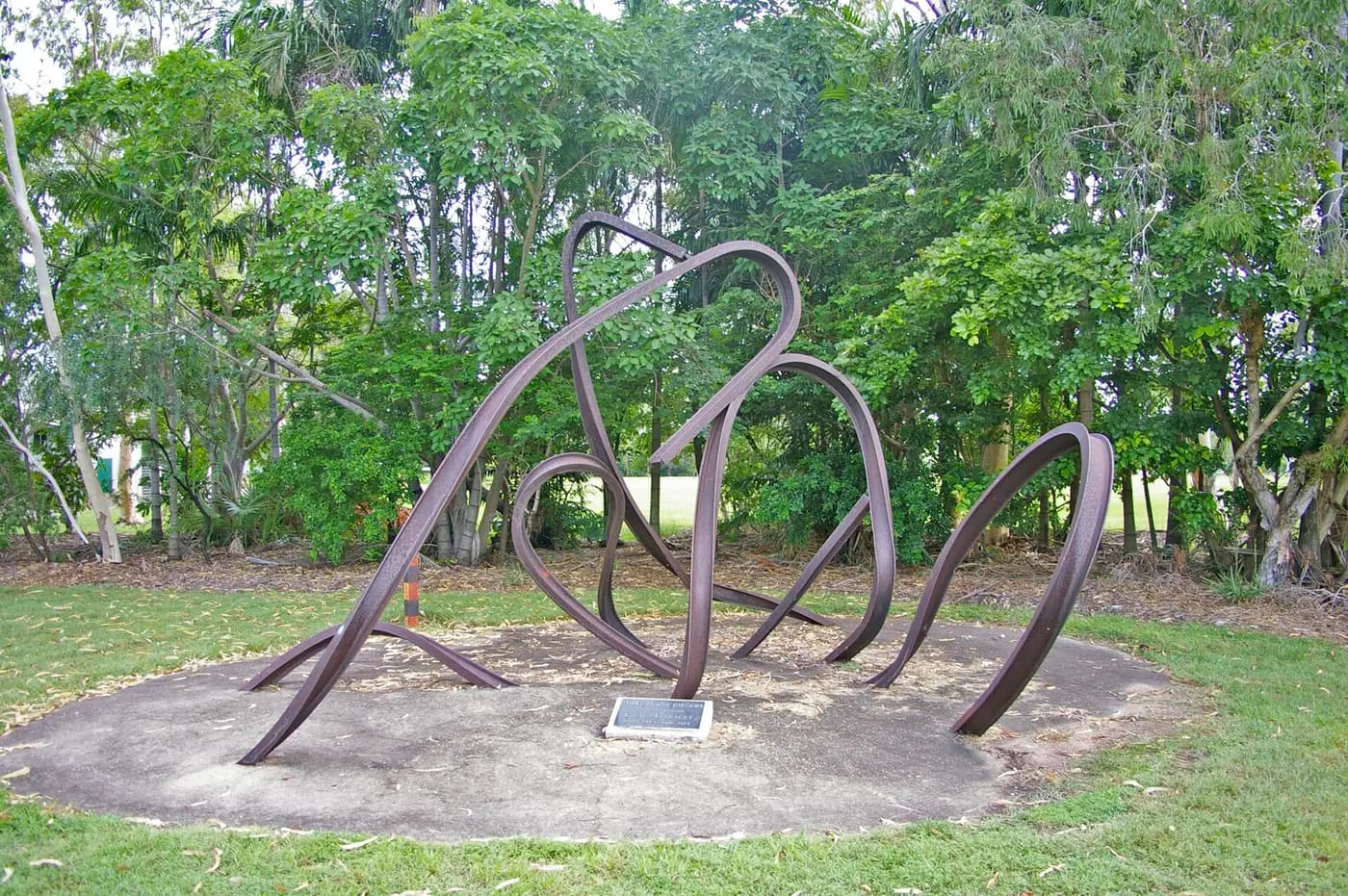 Three steel house girders twisted by Cyclone Tracy, preserved as a memorial in suburban Darwin