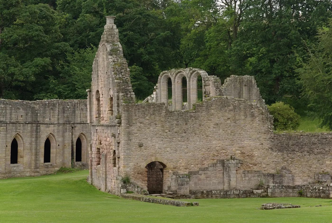Roofless walls and tower of Fountains Abbey, the Cistercian monastery surrendered to the Crown in 1539