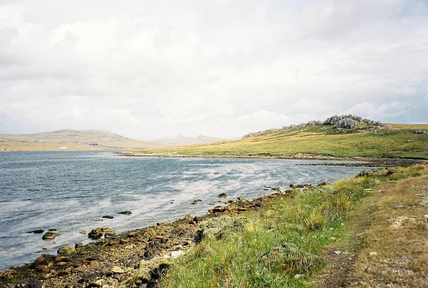 Mount Tumbledown, Two Sisters and Wireless Ridge rising beyond Stanley Harbour