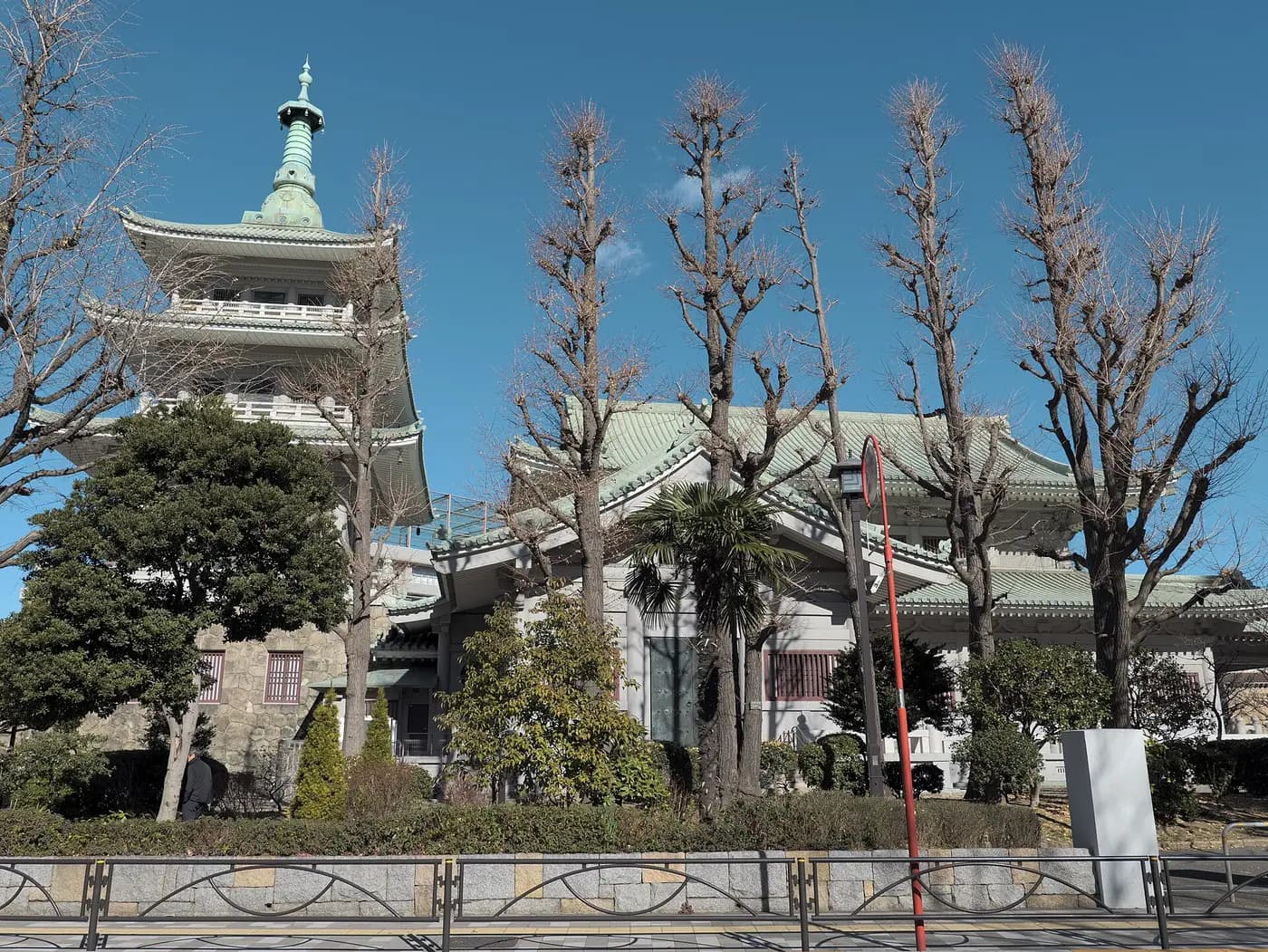 Tokyo Memorial Hall and its pagoda-style tower among trees in Yokoamichō Park