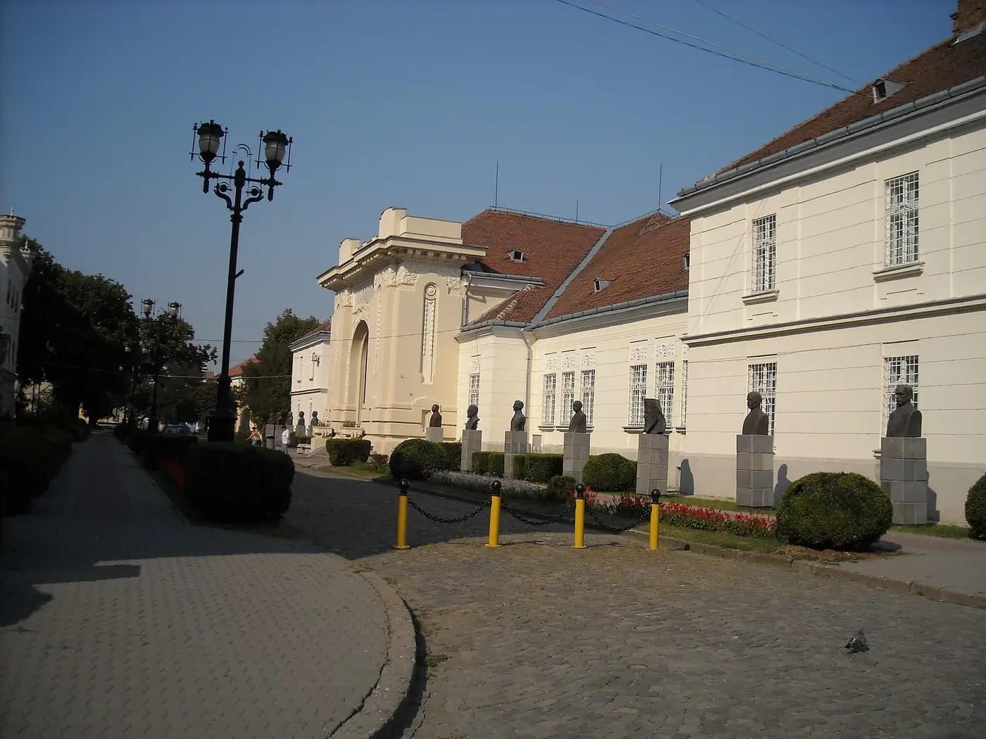 The Union Hall in Alba Iulia's citadel, fronted by a row of bronze busts