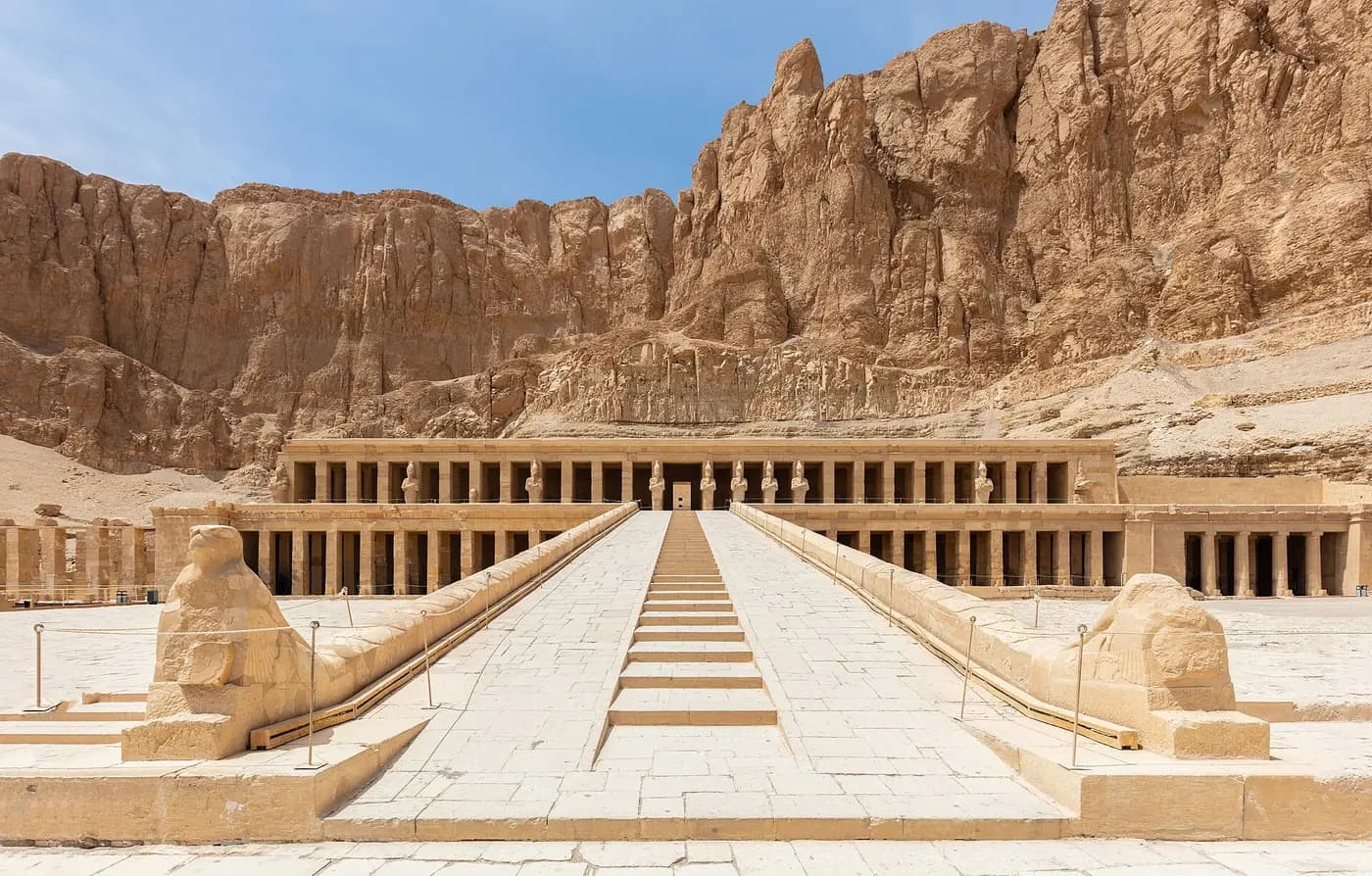 The terraced colonnades of Hatshepsut's temple at Deir el-Bahari beneath sheer limestone cliffs