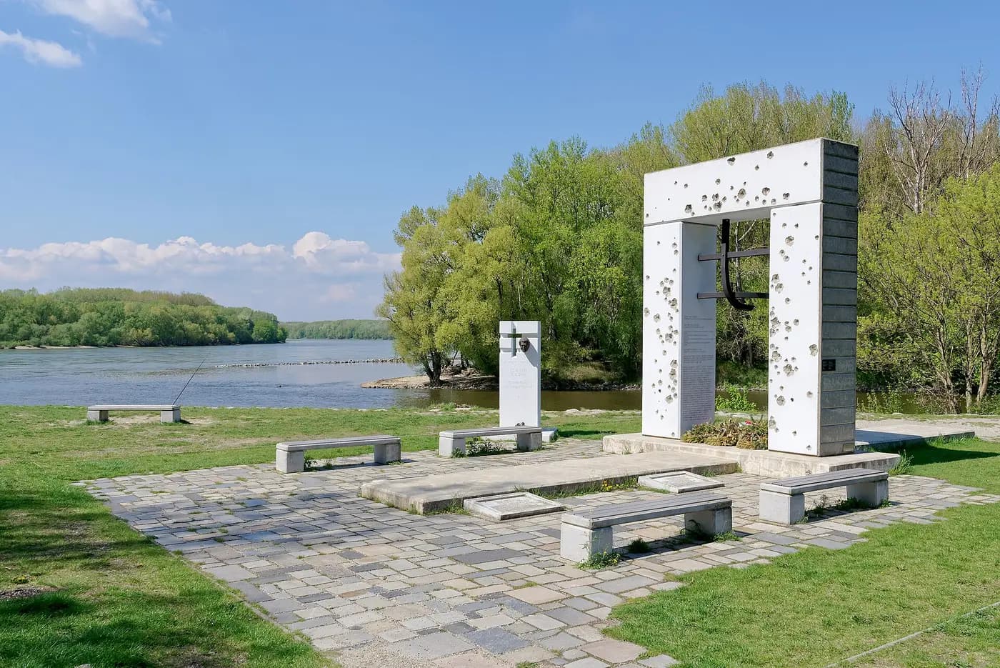 The bullet-pocked Gate of Freedom memorial to Iron Curtain victims beside the river below Devín
