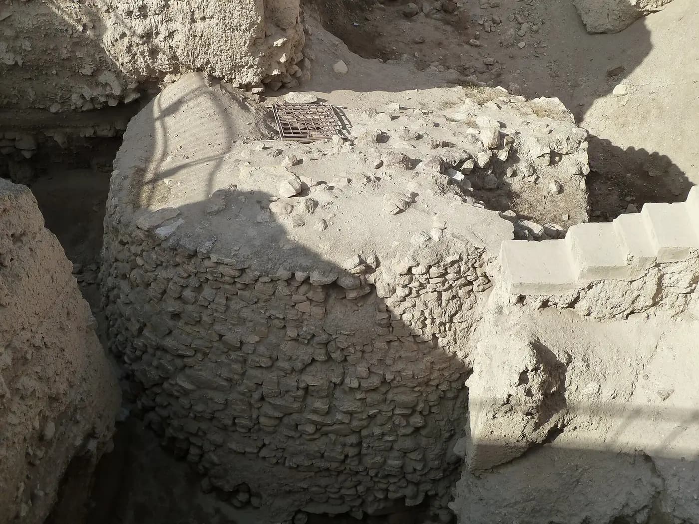 The round Neolithic stone tower exposed in an excavation trench at Tell es-Sultan, Jericho