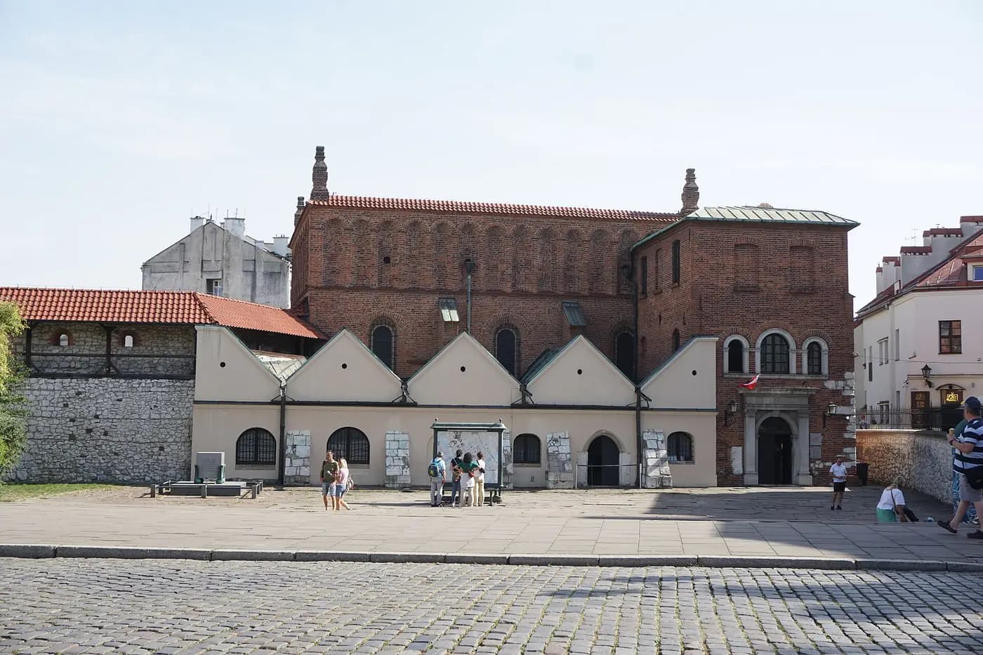 The Old Synagogue at the end of Szeroka Street in Kazimierz, Kraków, a brick building with a crenellated parapet