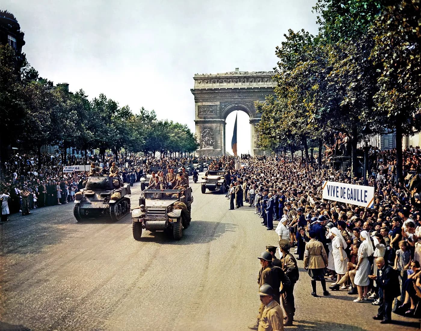 Crowds line the Champs-Élysées as Leclerc's armoured division passes the Arc de Triomphe, 26 August 1944