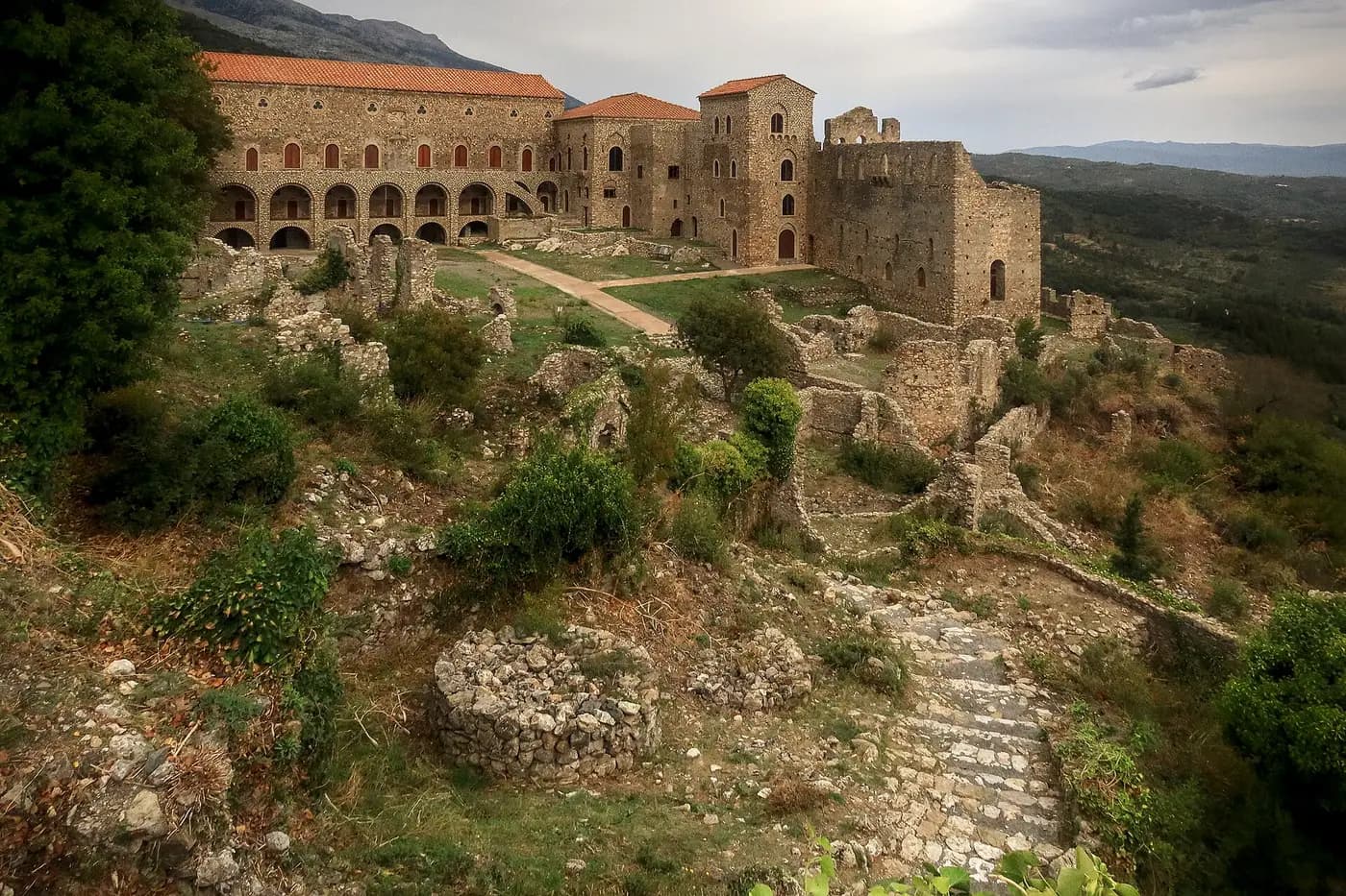The Palace of the Despots at Mystras on its hillside, above ruins and scrub