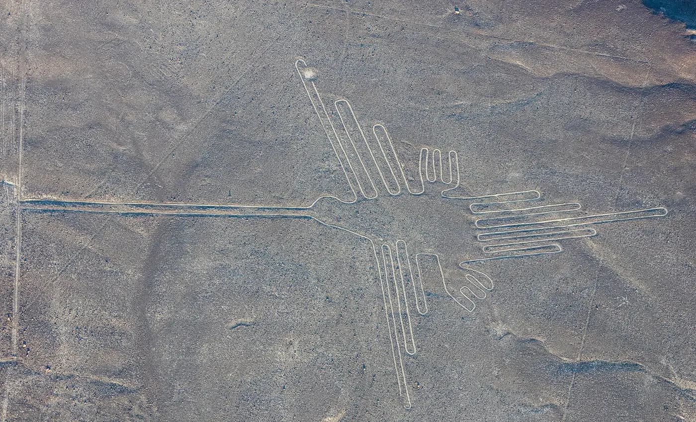 Aerial view of the hummingbird geoglyph etched into the Nazca desert floor
