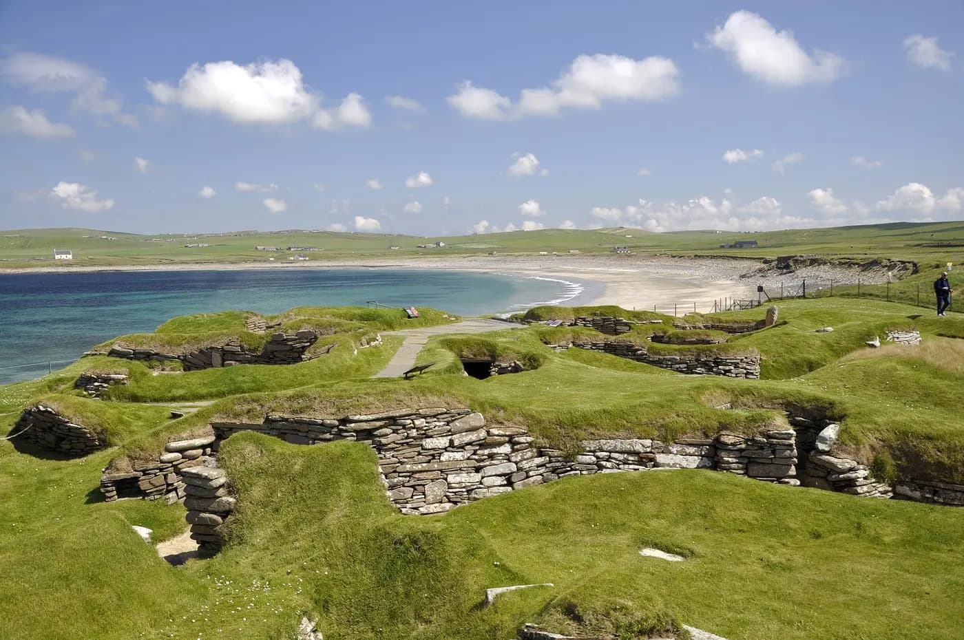 The stone-built Neolithic houses of Skara Brae beside the Orkney shore
