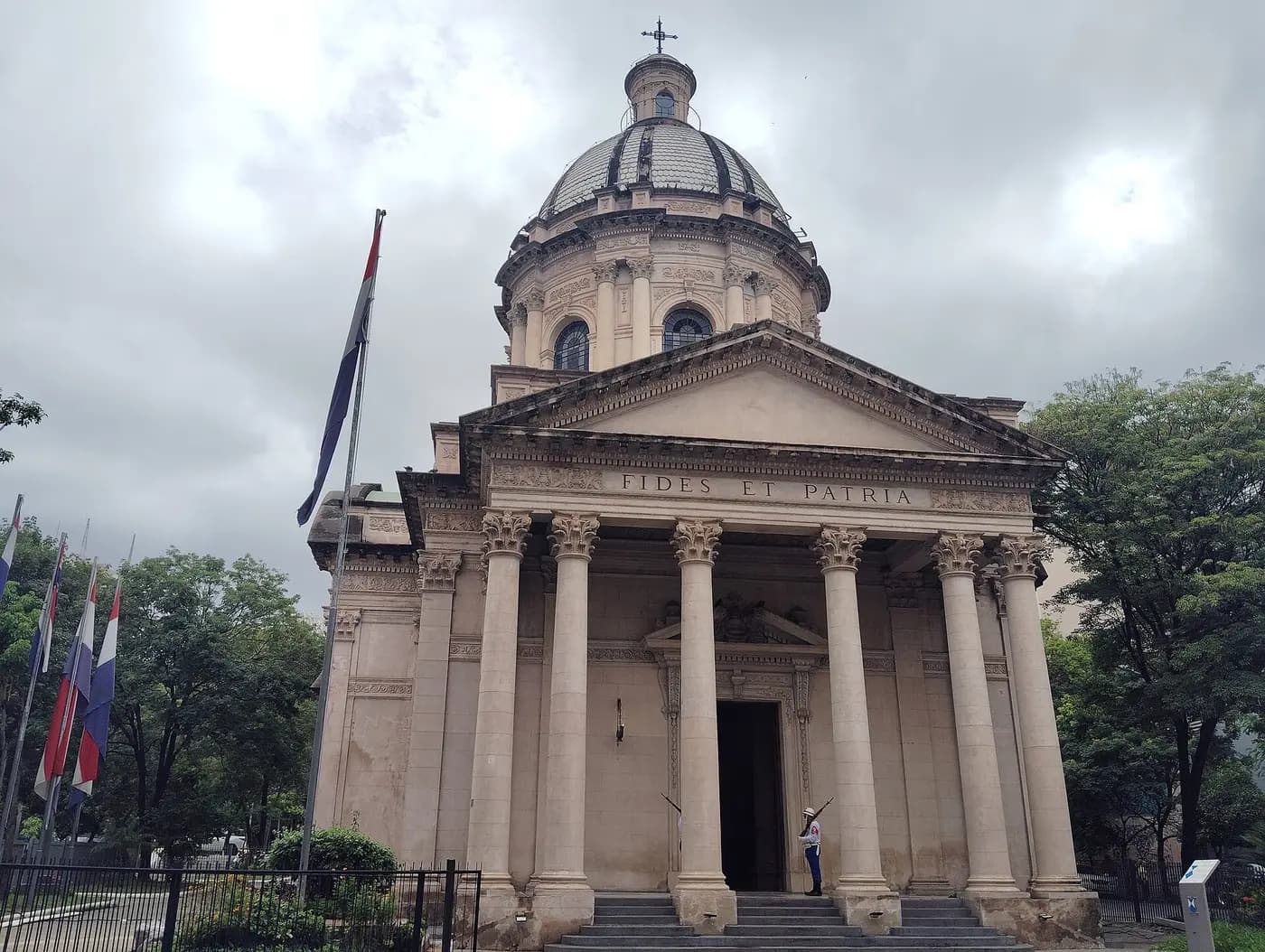 The domed neoclassical National Pantheon of the Heroes in Asunción, with flags outside