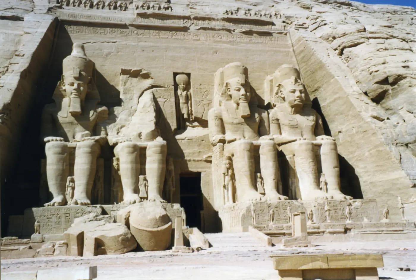 Four colossal seated statues of Ramesses II carved into the rock façade of the Great Temple at Abu Simbel
