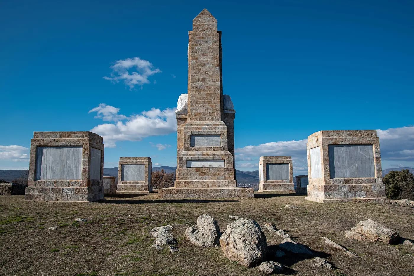 The Doiran Memorial, a stone obelisk with flanking panels on a hill near Lake Doiran