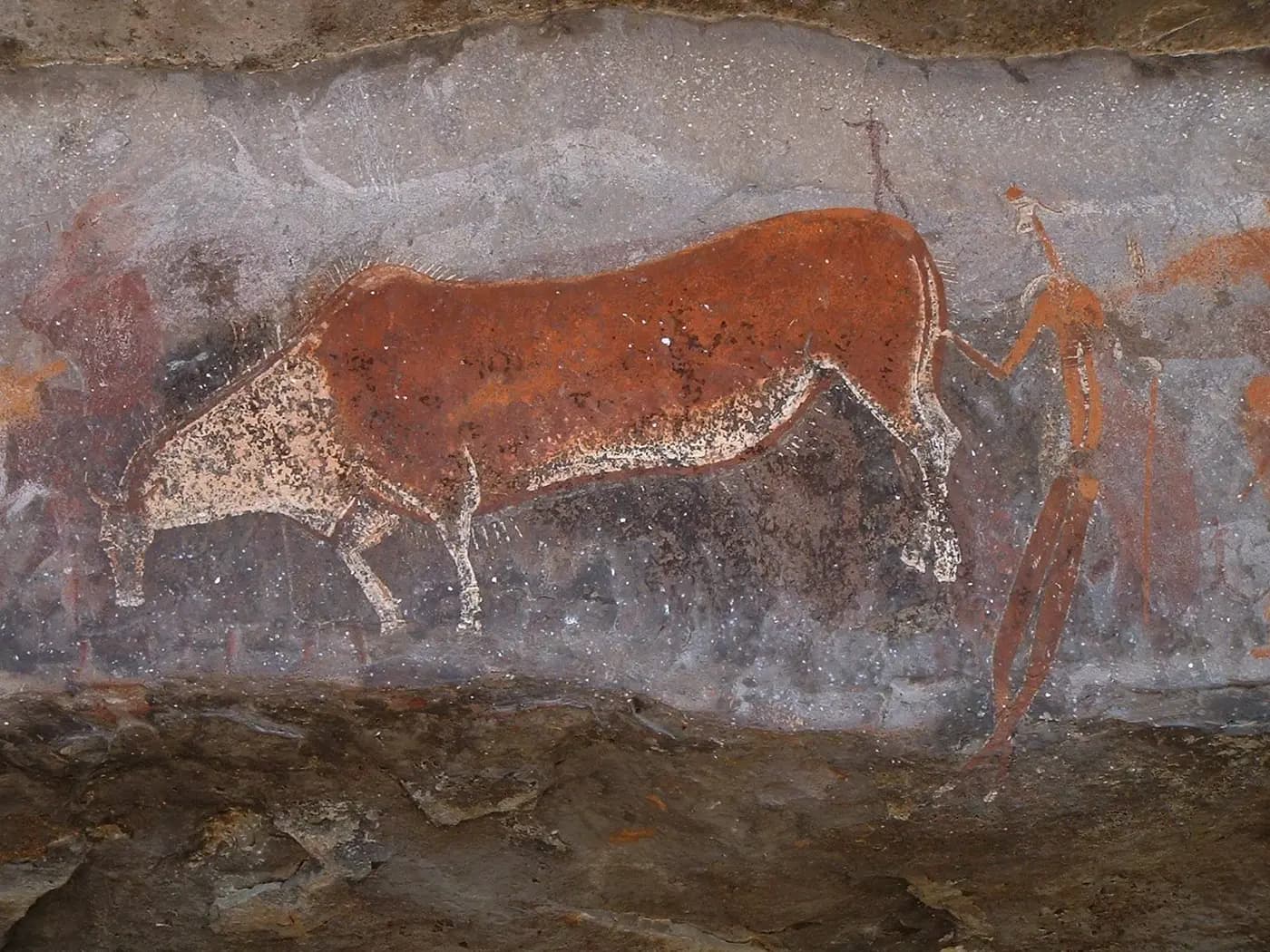 San rock painting of an eland and a human figure on the wall of Game Pass Shelter, Drakensberg