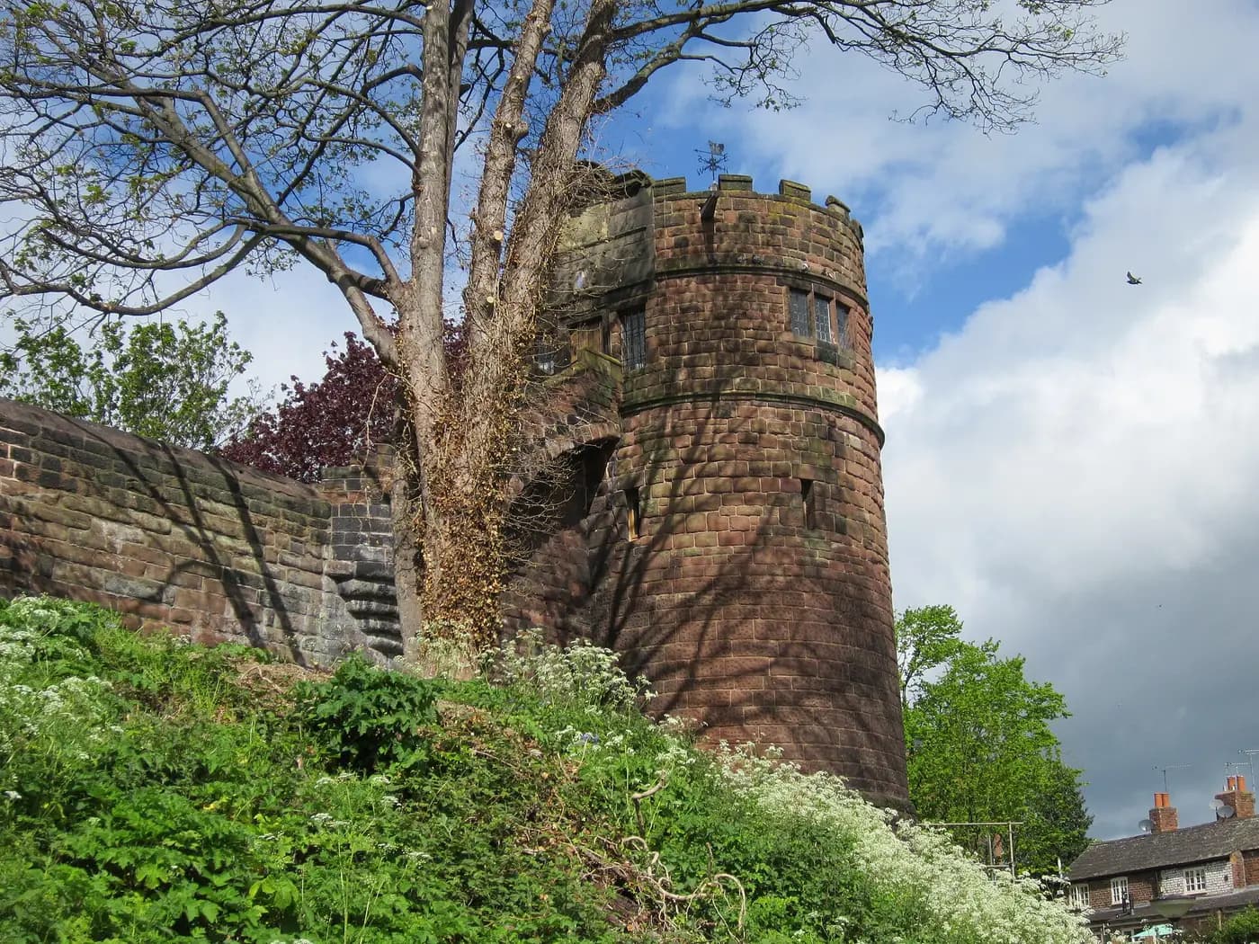 King Charles' Tower, a round sandstone tower on Chester's city walls, framed by trees