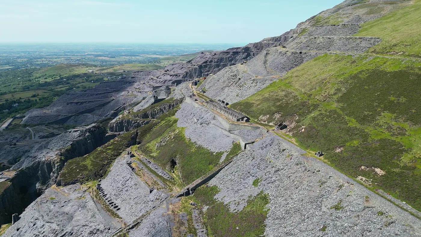 Aerial view of the stepped grey terraces and slate tips of the Dinorwig quarry above Llanberis