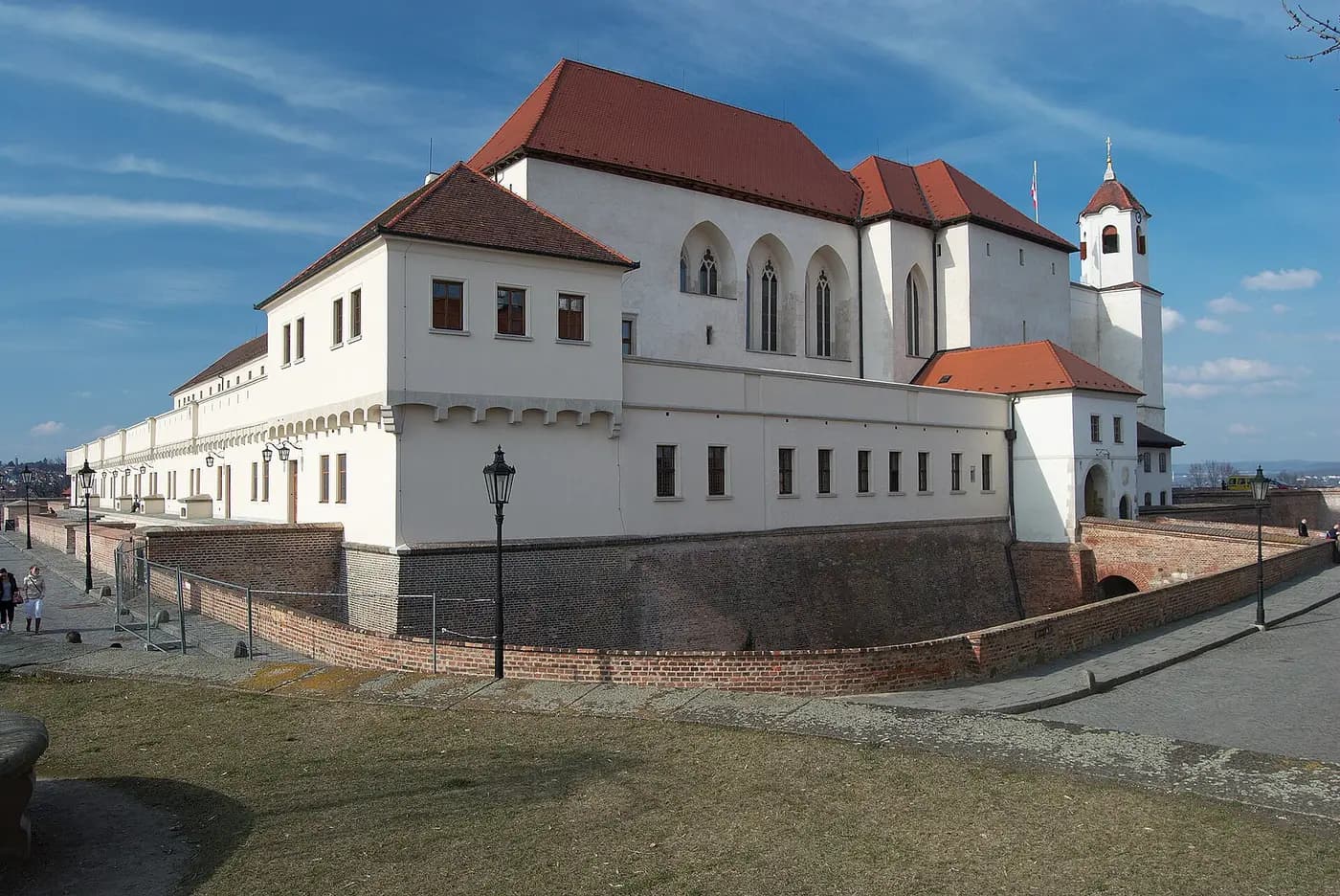 Špilberk Castle's long white walls and red roofs on its hilltop above Brno