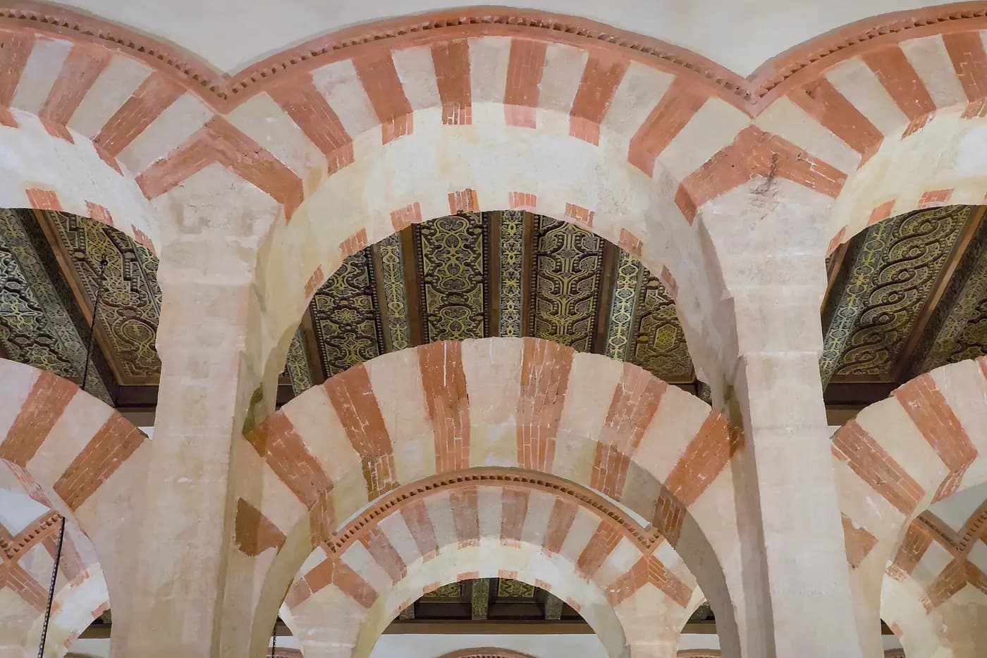 Rows of red-and-white striped arches inside the Great Mosque of Córdoba