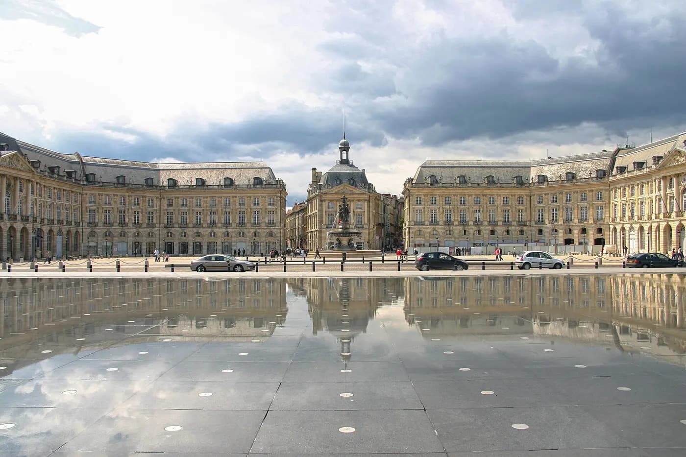 Eighteenth-century Place de la Bourse in Bordeaux reflected in the shallow water mirror on the quay