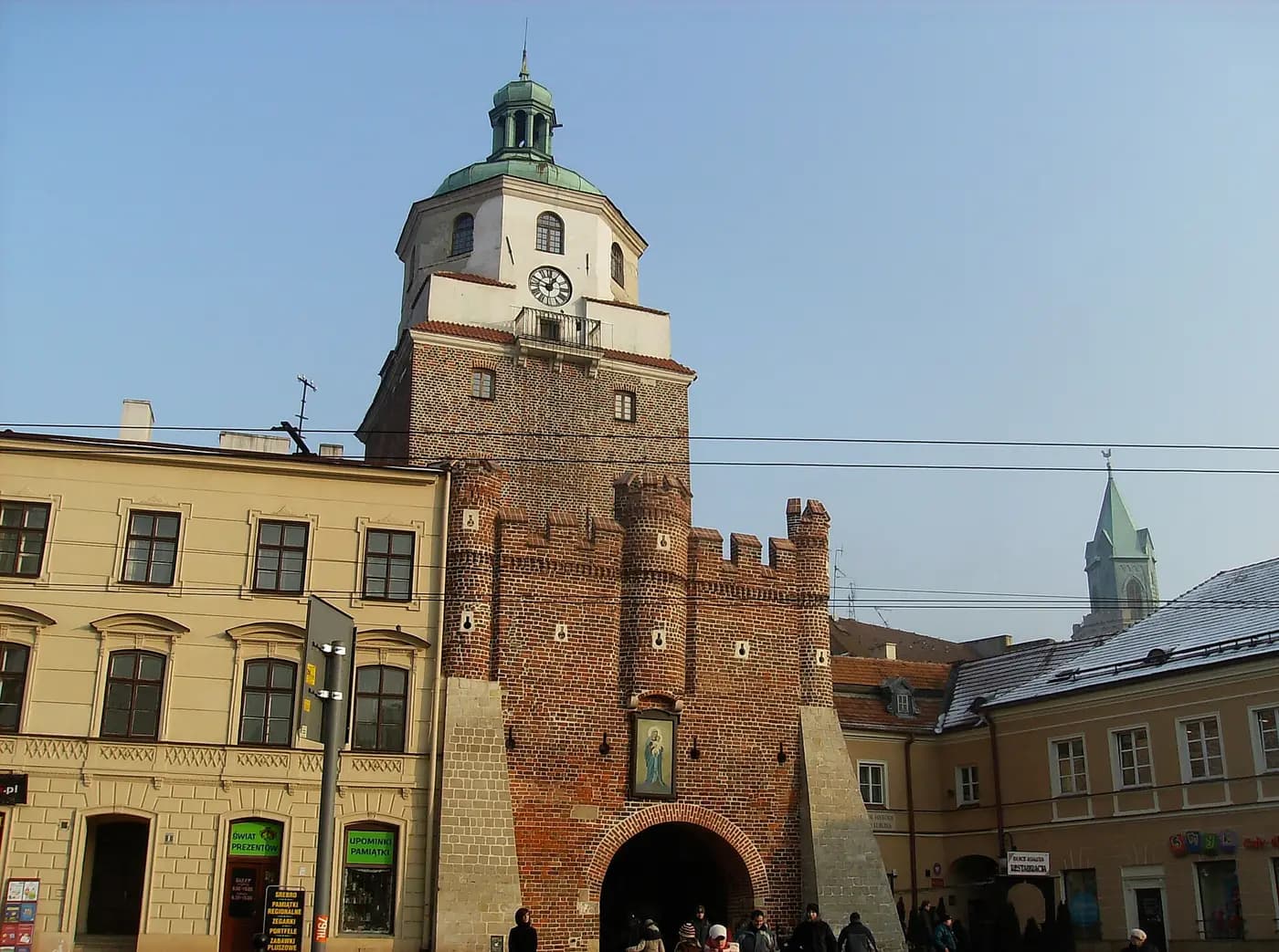 The Kraków Gate, a Gothic brick tower with a baroque cupola, at the edge of Lublin's Old Town
