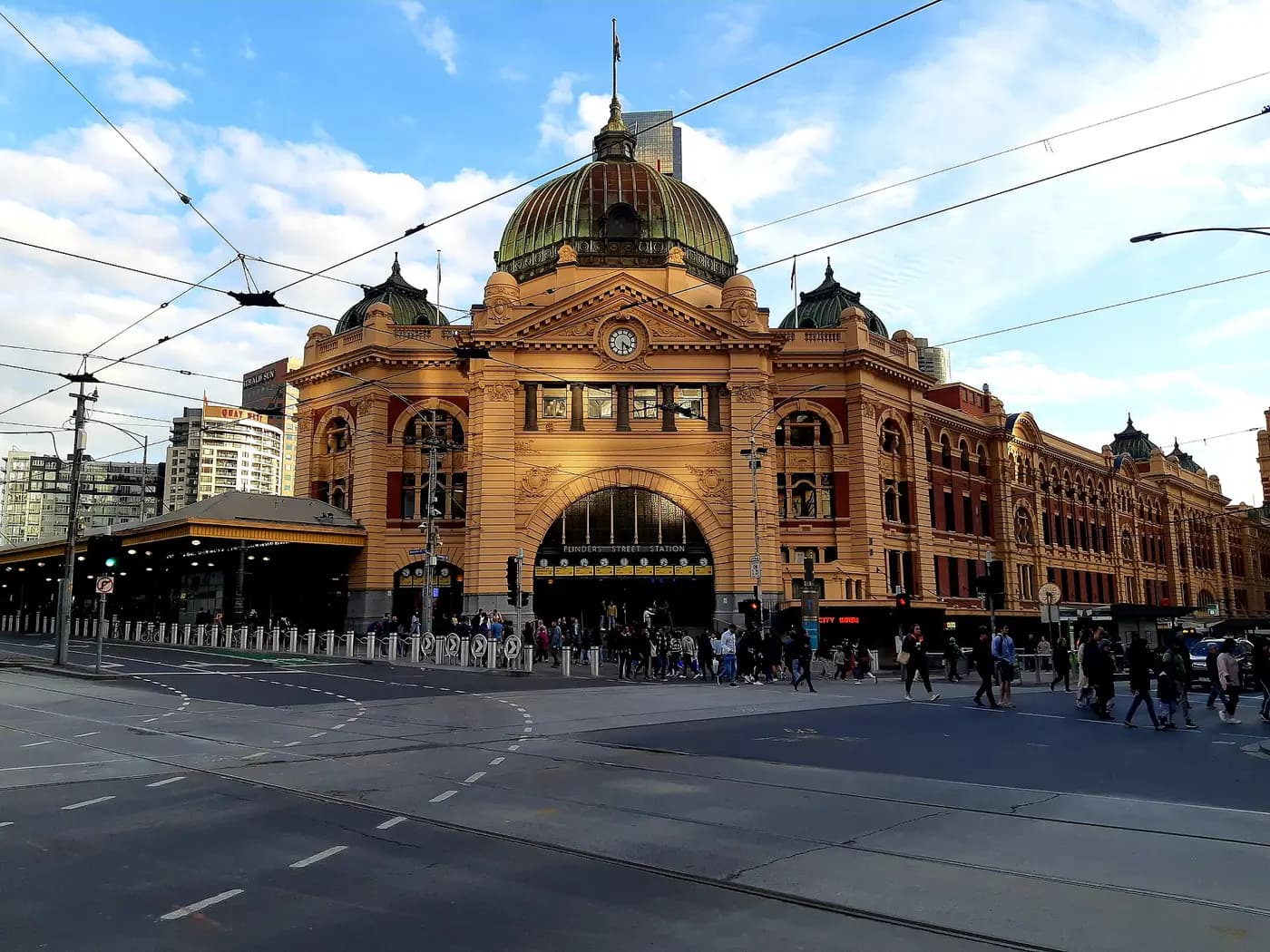 Flinders Street Station's domed entrance and clock tower on the corner of Swanston Street, Melbourne