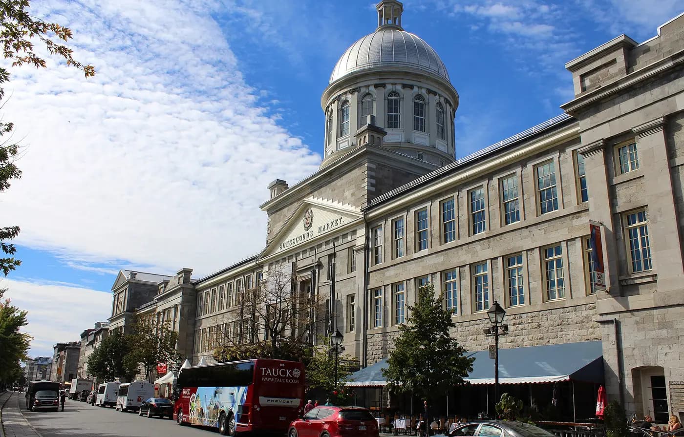 The silver dome and long stone front of Bonsecours Market on Rue Saint-Paul, Old Montreal