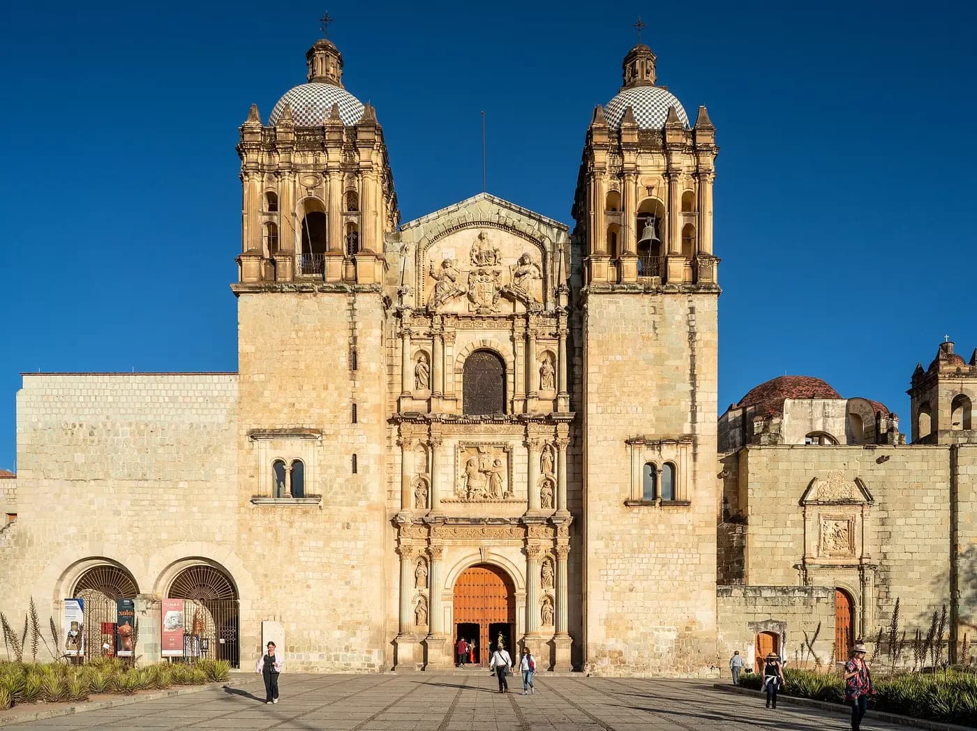 The baroque stone front and twin towers of the Church of Santo Domingo de Guzmán in Oaxaca