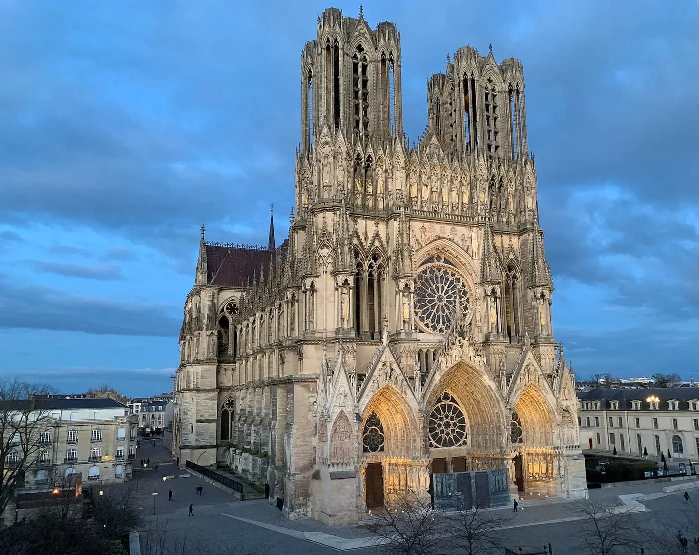 The Gothic west front and twin towers of Reims Cathedral, where French kings were crowned
