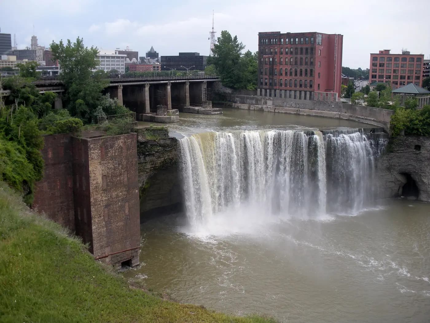 The High Falls of the Genesee River in Rochester, with old brick mill buildings above the gorge
