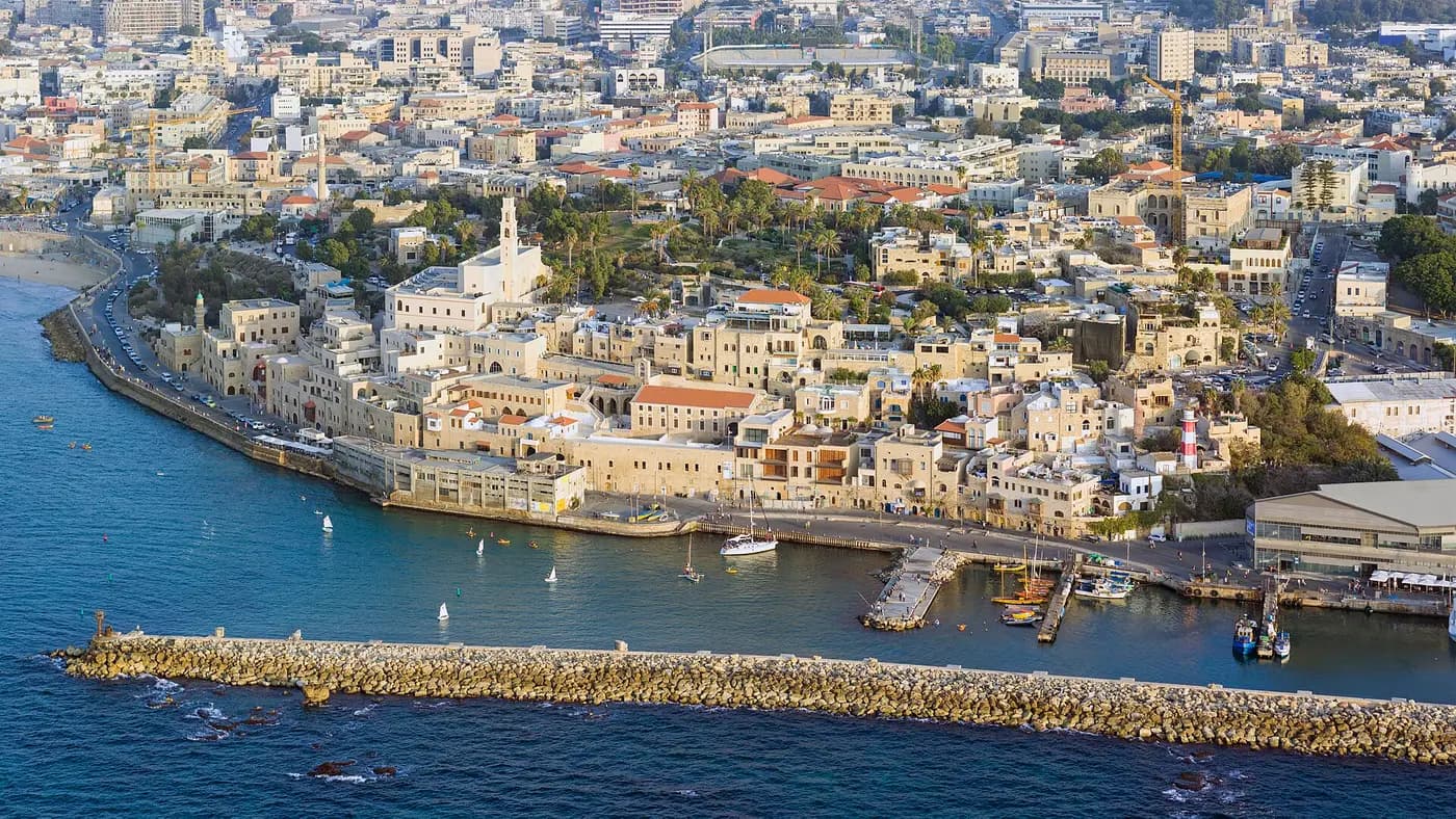 Aerial view of Old Jaffa's hilltop town and church above its small harbour on the Mediterranean