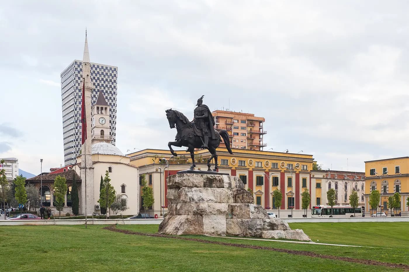 The equestrian statue of Skanderbeg on Tirana's main square, with the Et'hem Bey Mosque and clock tower