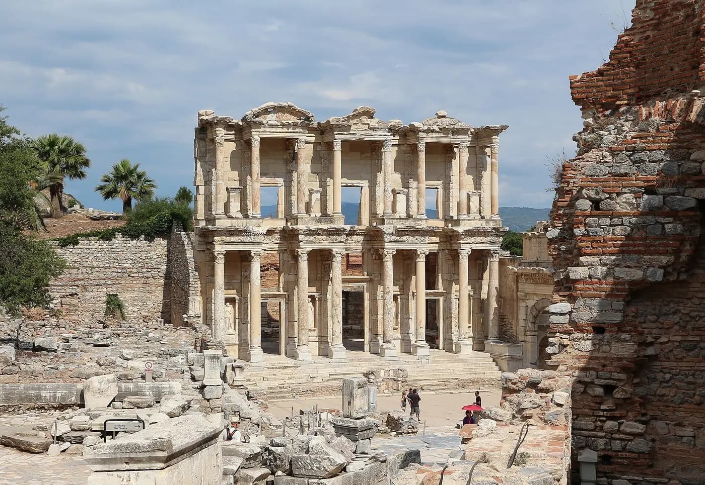 The two-storey columned facade of the Library of Celsus rising above the ruins of Ephesus